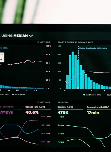 Laptop showing an analytics dashboard with traffic charts