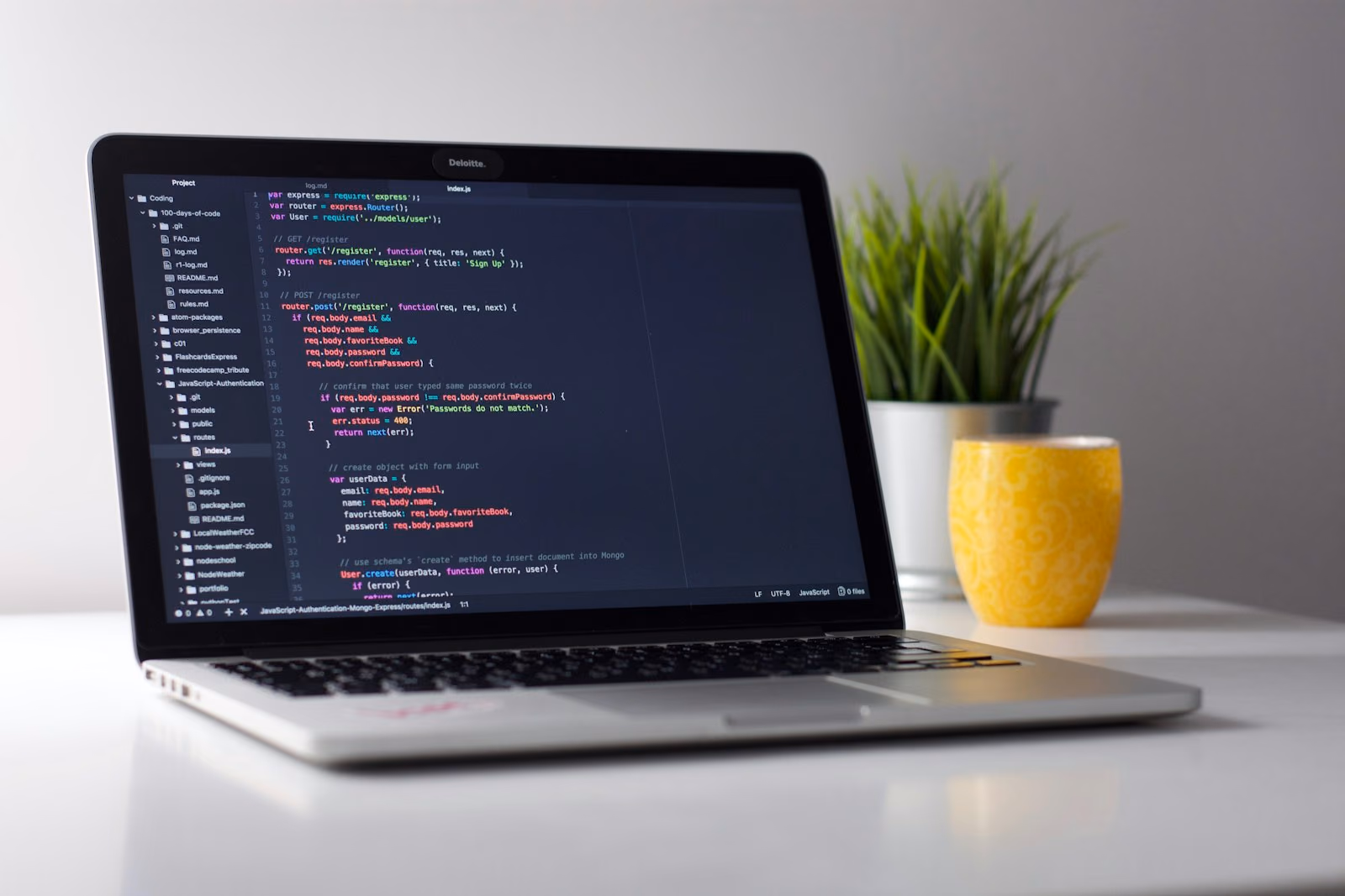 Laptop showing website code during a WordPress build